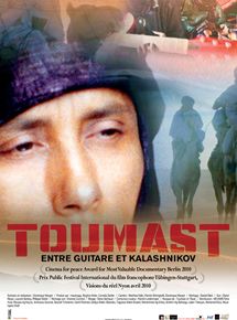 Affiche du film Toumast – Entre Guitare et Kalashnikov (2010) de Dominique Margot. Voir Toumast – Entre Guitare et Kalashnikov en streaming / torrent sur meilleurs-films.fr